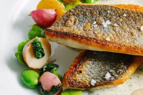Pan-seared striped bass with spring vegetables